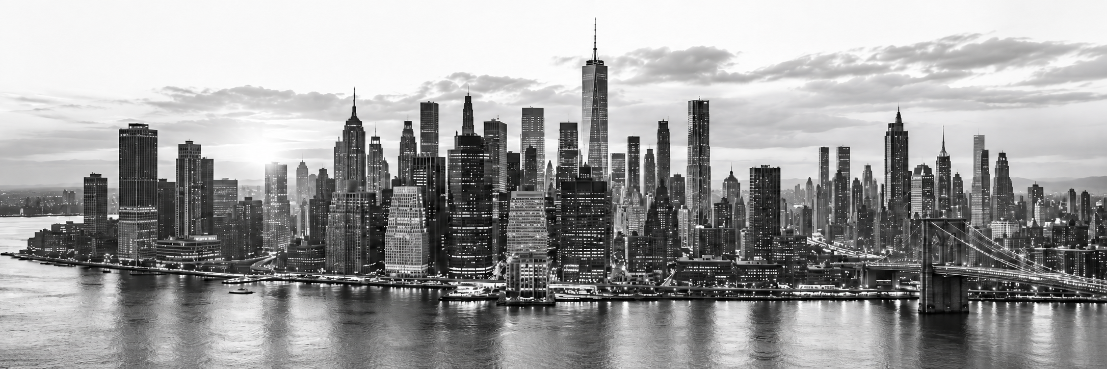 Black-and-white city skyline across the waterfront